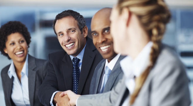 happy-business-colleagues-shaking-hands-9782927-Medium